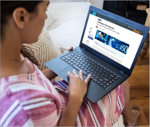 Woman Reading a Looking to the Futures Article